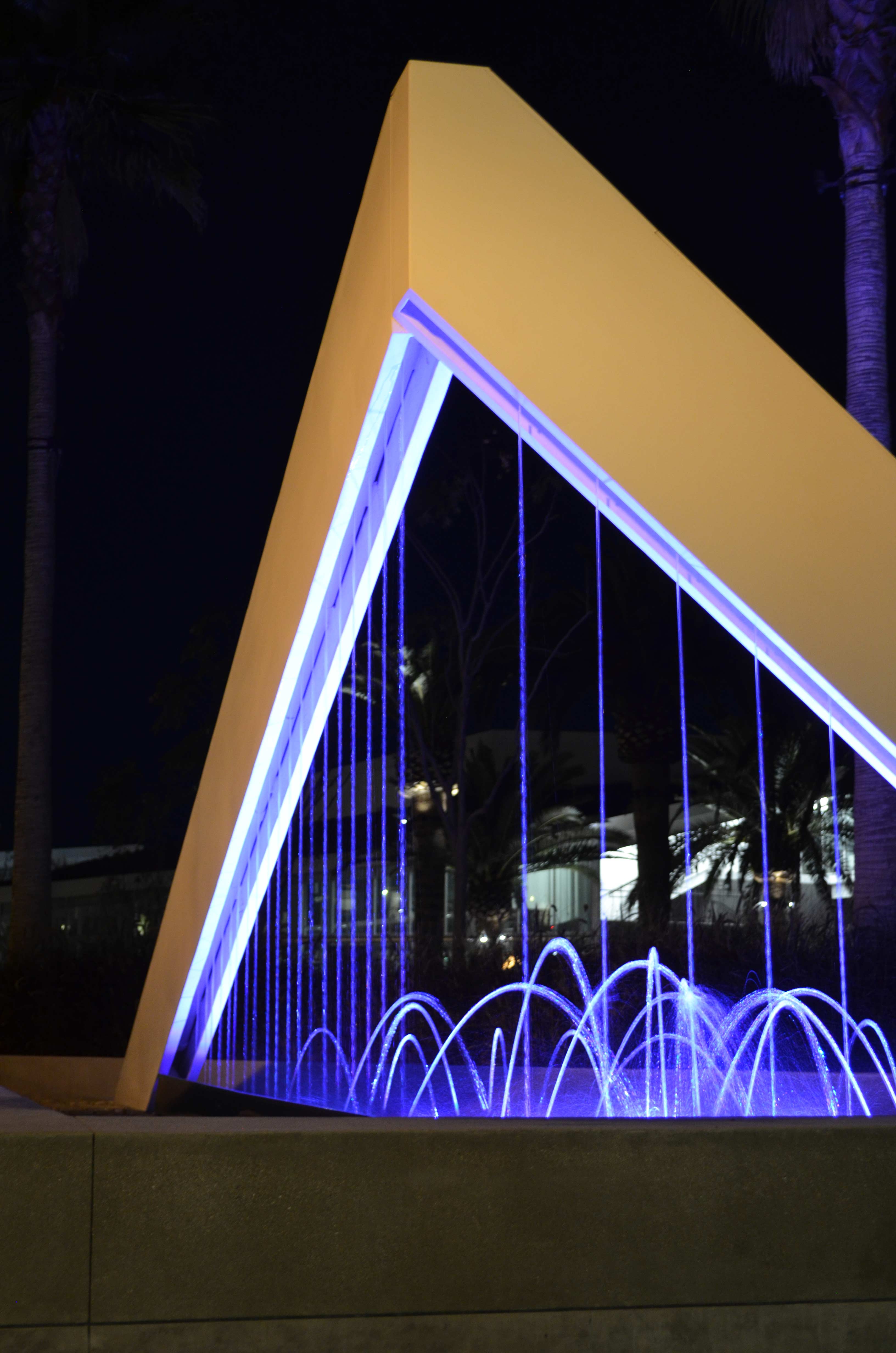 Public Art fountain at night with water jets